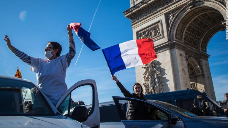 'Freedom Caravan' protesters enter Paris and cut off traffic before being dispersed with tear gas

