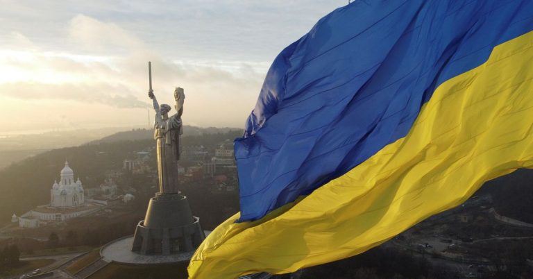 'We fear no one' Ukrainians raise flags to defy fear of Russian invasion

