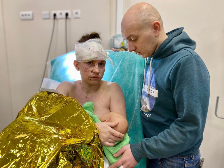 Olga and her husband Dmytro at the Ohmatdit Children's Hospital. According to the hospital, Olga covered the baby with her body, miraculously saving her daughter from injuries. 