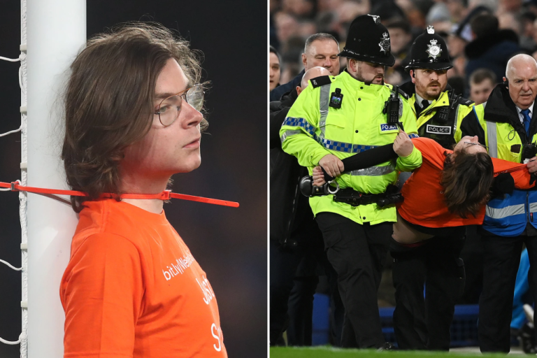 The protester attaches himself to the goal post in the Premier League match between Everton and Newcastle United

