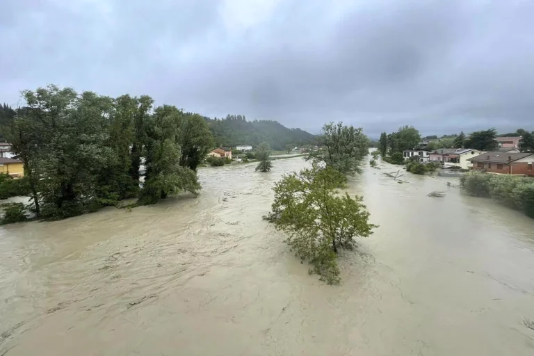 Five dead as torrential rain washed down riverbanks in northern Italy, inundating towns

