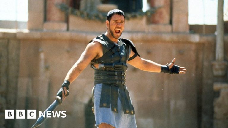 The injured Gladiator sequel crew members perform in a stunt sequence on set

