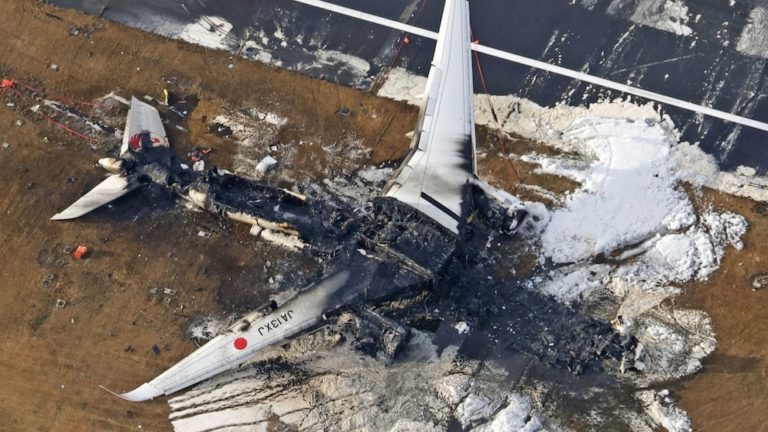 The report showed that warning lights on the runway were broken at the time of the fire on the Japan Airlines plane