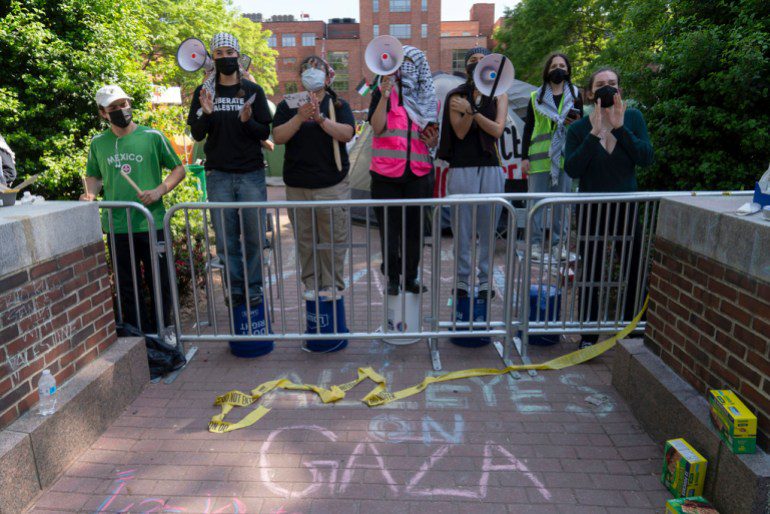 George Washington University students demonstrate on campus after police closed down the student camp during a pro-Palestinian protest over the war between Israel and Hamas on Friday, April 26, 2024, in Washington.  (AP Photo/Jose Luis Magaña)