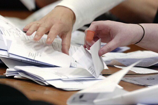 Counting begins in the Blackpool South by-election at the Blackpool Sports Center in Blackpool, England, Thursday, May 2, 2024. The by-election began after the resignation of Scott Benton.  (Peter Byrne/PA via AP)