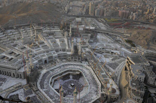 Muslim pilgrims circumambulate the Kaaba, the cubic structure in the Grand Mosque, during the annual Hajj in Mecca, Saudi Arabia, Tuesday, June 11, 2024. (AP Photo/Rafiq Maqbool)