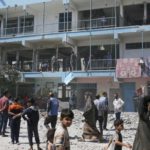 An Israeli raid kills at least 33 people at a Gaza school that the army claims is used by Hamas.