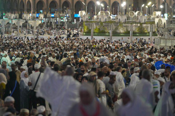 Muslim pilgrims pray at the Grand Mosque, during the annual Hajj in Mecca, Saudi Arabia, Tuesday, June 11, 2024. (AP Photo/Rafiq Maqbool)