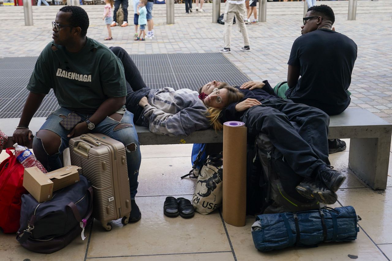 Travelers rest outside Gare de Bordeaux Saint-Jean train station in Bordeaux, France. 