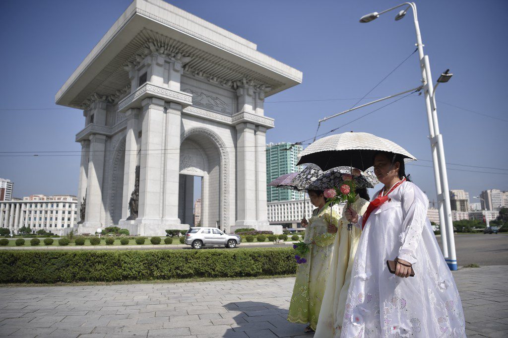 Pedestrians walk past the Arc de Triomphe in Pyongyang on Aug. 15, 2024, as North Korea celebrates its 79th National Liberation Day, commemorating the end of Japanese colonial rule at the end of World War II.