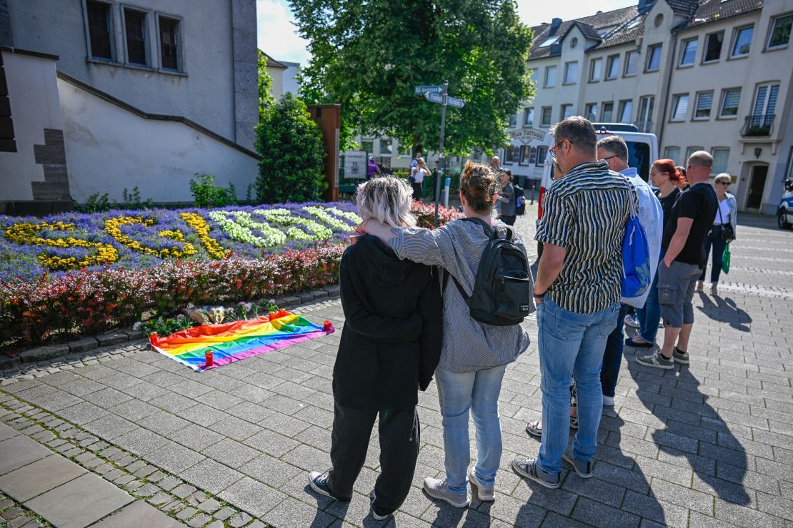 People mourn the victims of Friday's deadly stabbing attack.