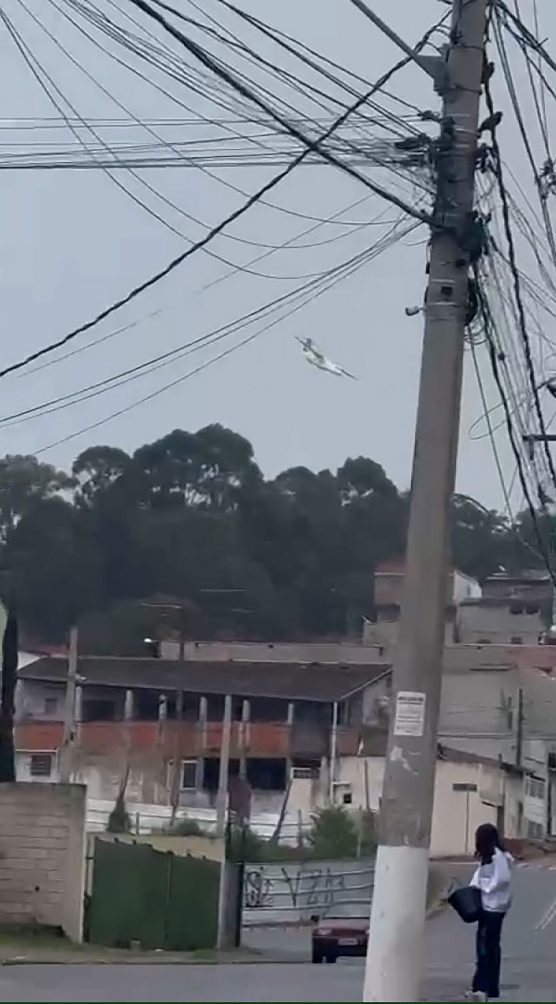 A plane is seen falling from the sky over the city of Vinhedo, Brazil, on August 9, 2024.